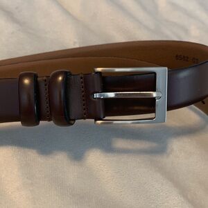 The mens warehouse smooth brown leather belt made in Italy size 38 thin dressy